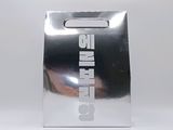 a silver bag that is sitting on a table