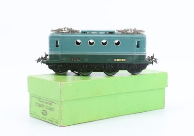 a toy train sitting on top of a green box