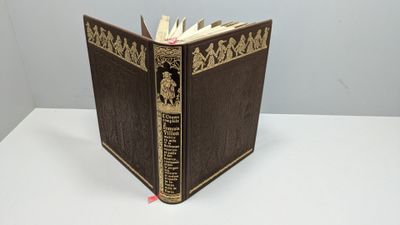 an old book sitting on top of a white table