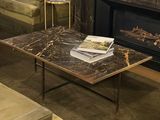 a coffee table with a book on top of it in a living room