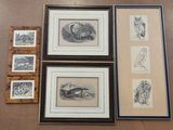 four framed pictures of animals and birds on a table