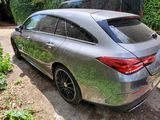 a silver car parked on the side of the road