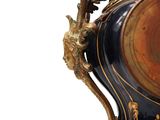 a large vase with a gold and black decoration on it