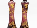 two vases that have been decorated with flowers on them