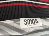 the label of a sweater is displayed on the back of a jacket