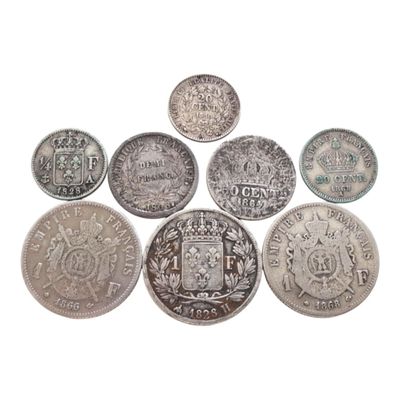 six types différents de pièces d'argent sur fond blanc