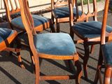 six chairs that are sitting in the parking lot