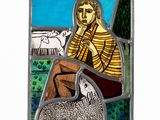 a picture of a stained glass picture of a man with a sheep