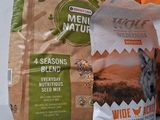 a bag of dog food next to a bag of dog food