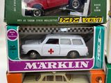 three boxes of toy cars are stacked on top of each other