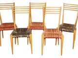 four chairs that are sitting next to each other