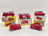 four toy firetrucks sitting on top of each other