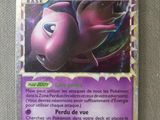 a close up of a purple pokemon card on a table