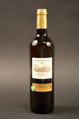 a bottle of wine that is sitting on a table