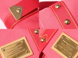 the pink bag has a gold buckle on the side of it