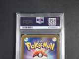 a close up of a pokemon card on a table