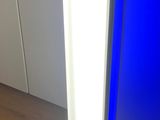 a lamp that is sitting on the floor next to a table