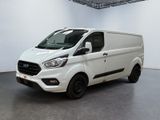 a white van is parked in a large room
