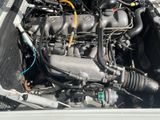 a picture of a car engine in the back of a truck