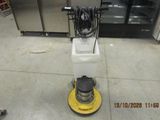 a machine that is sitting on the floor in the kitchen