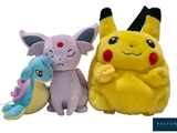 two stuffed animals that are sitting next to each other