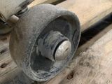 a close up of a skateboard on a wooden surface