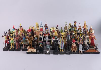 a close up of a group of figurines on a white surface