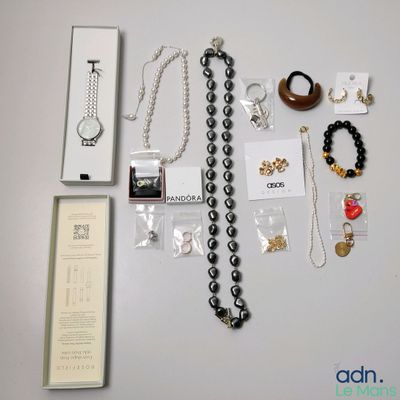 a lot of jewelry that is on the table