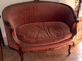 a red couch that is sitting in a room