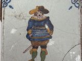 a small tile with a picture of a man on it