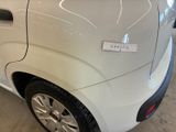 a small white car with a sticker on the side of it