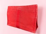a red purse on a white background