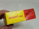 a person holding a box of dinky toys
