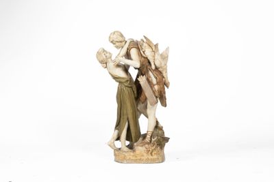 une image représentant une figurine d'un ange et d'une femme