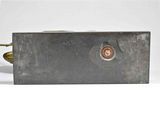 an image of a close up of a metal object on a white surface