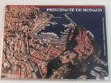 an aerial view of the city of monaco, france, with boats docked in the harbor