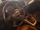 dashboard of a car with a steering wheel and dashboard controls