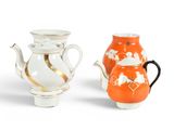 two small vases that are sitting next to each other