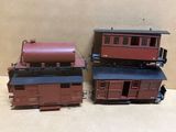 two model trains are sitting side by side on a table