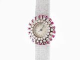 an image of a woman ' s wrist watch with pink and white stones