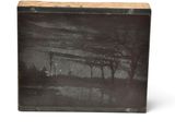a black and white photo of a wooden box with a picture on it