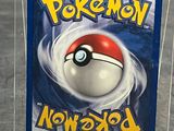 a plastic box with a pokemon card inside of it