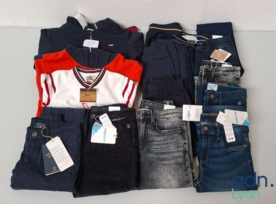 a lot of clothes that are on display on a table