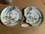 two plates that are sitting on a cardboard box