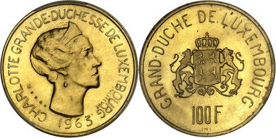 a close up of a coin with a woman ' s face on it