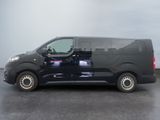 a black van that is parked in a parking lot