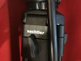 the camera is attached to a tripod on a red surface