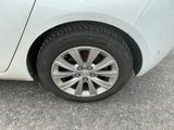 a close up of a car ' s tire on the road
