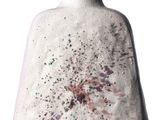 a white vase with a red stripe on it