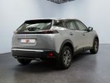 the rear end of a silver suv parked in a garage
